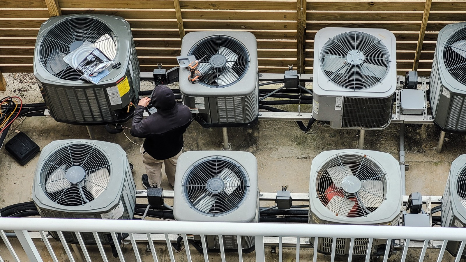 Multiple air conditioning condenser units installed on building exterior — AC installation and HVAC services Miami FL