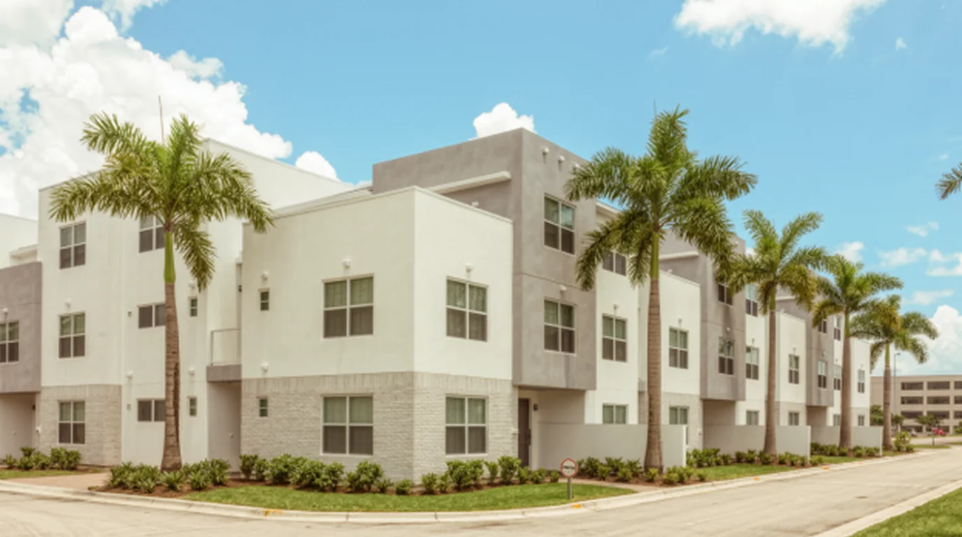Modern two-story townhomes with palm trees in Doral, Florida